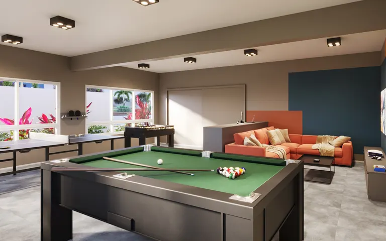 Sala de jogos com videogame e mesa de jogos